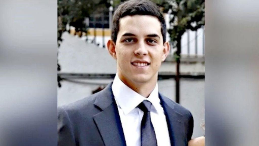Portrait of a Young Man in a Dark Suit and Tie, Smiling at the Camera Outdoors. › La Sierra Madre