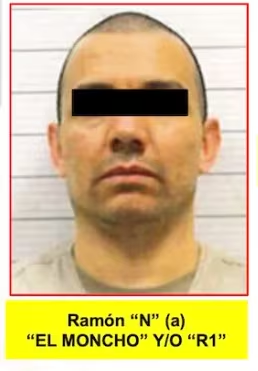 Image › La Sierra Madre Mugshot-style Photo of a Man with a Black Bar over His Eyes, Facing Forward; Beige Shirt, Background with Horizontal Lines; Yellow Caption Below Reads Ramón N (a) 'el Moncho' Y/o 'r1' › La Sierra Madre