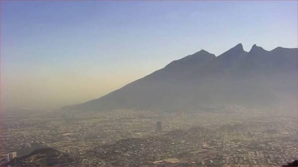 Arboles-nuevo-leon-samuel-garcia 1 › La Sierra Madre Cityscape Sprawling to the Horizon with a Large Mountain Silhouetted Against a Pale Dawn Sky. › La Sierra Madre