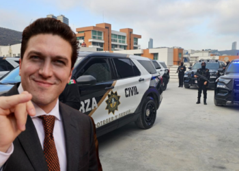 Man in a Suit Taking a Selfie in a Parking Lot with Police Suvs Labeled 'civil' and Officers in Tactical Gear in the Background, › La Sierra Madre
